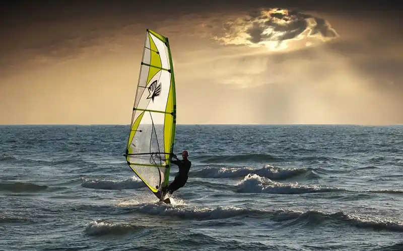 Sailboarder on water